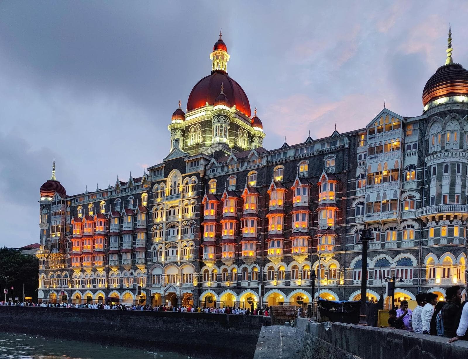Taj Mahal Palace Hotel Mumbai with flock of birds in motion – Iconic Indian landmark and luxury hotel near Gateway of India | Apply for Indian eVisa online at Globally eVisas